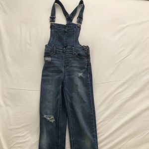Celebrity pink distressed overalls